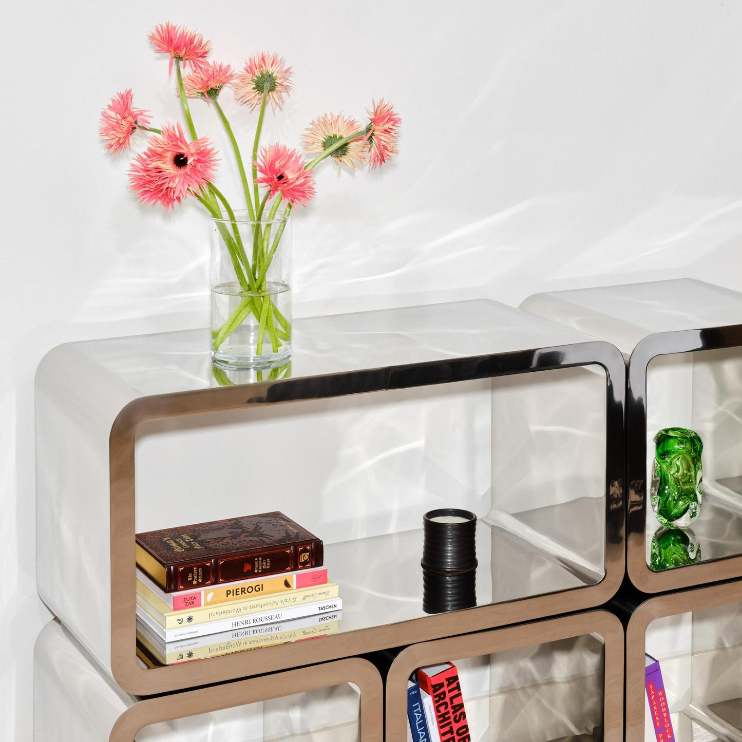 The Mercury Table with books and flowers